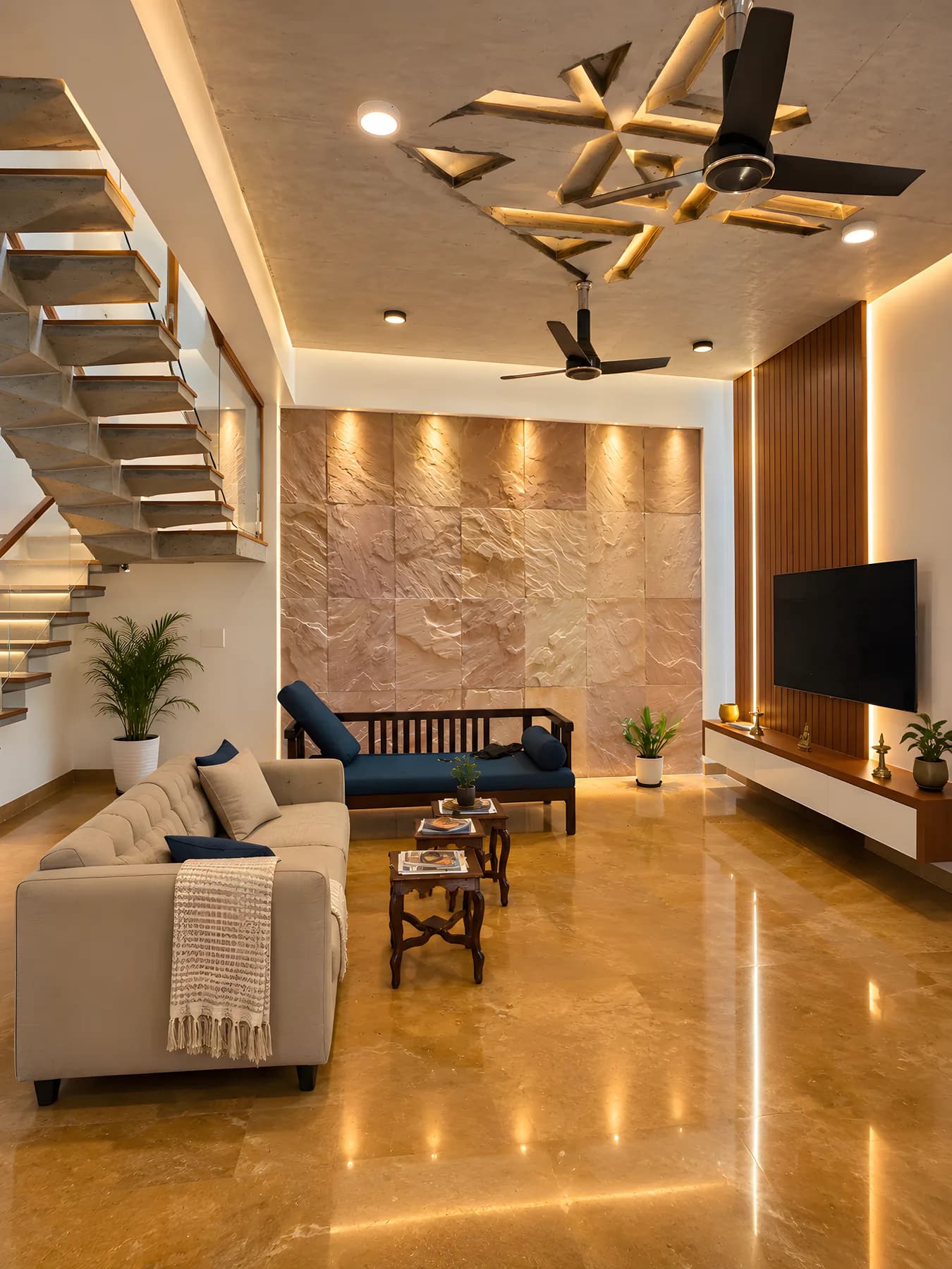 Living room interior design with a backlit sandstone feature wall, fluted wood TV panel, polished stone flooring and an open stair alongside